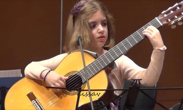 Watch In Awe As This 7-Year-Old Bamboozles You With Her Masterful Guitar Skills