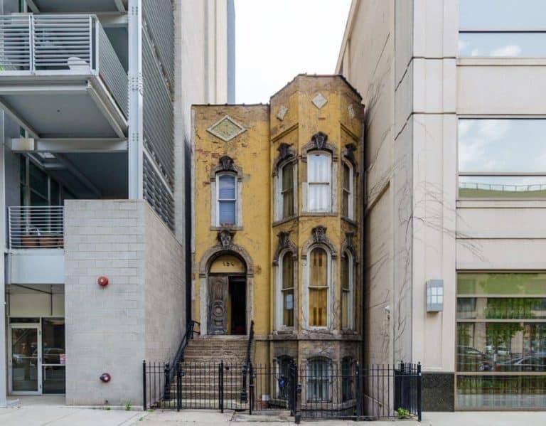 154 W. Superior St. – The Old Row House Surrounded By Towering High-Rises