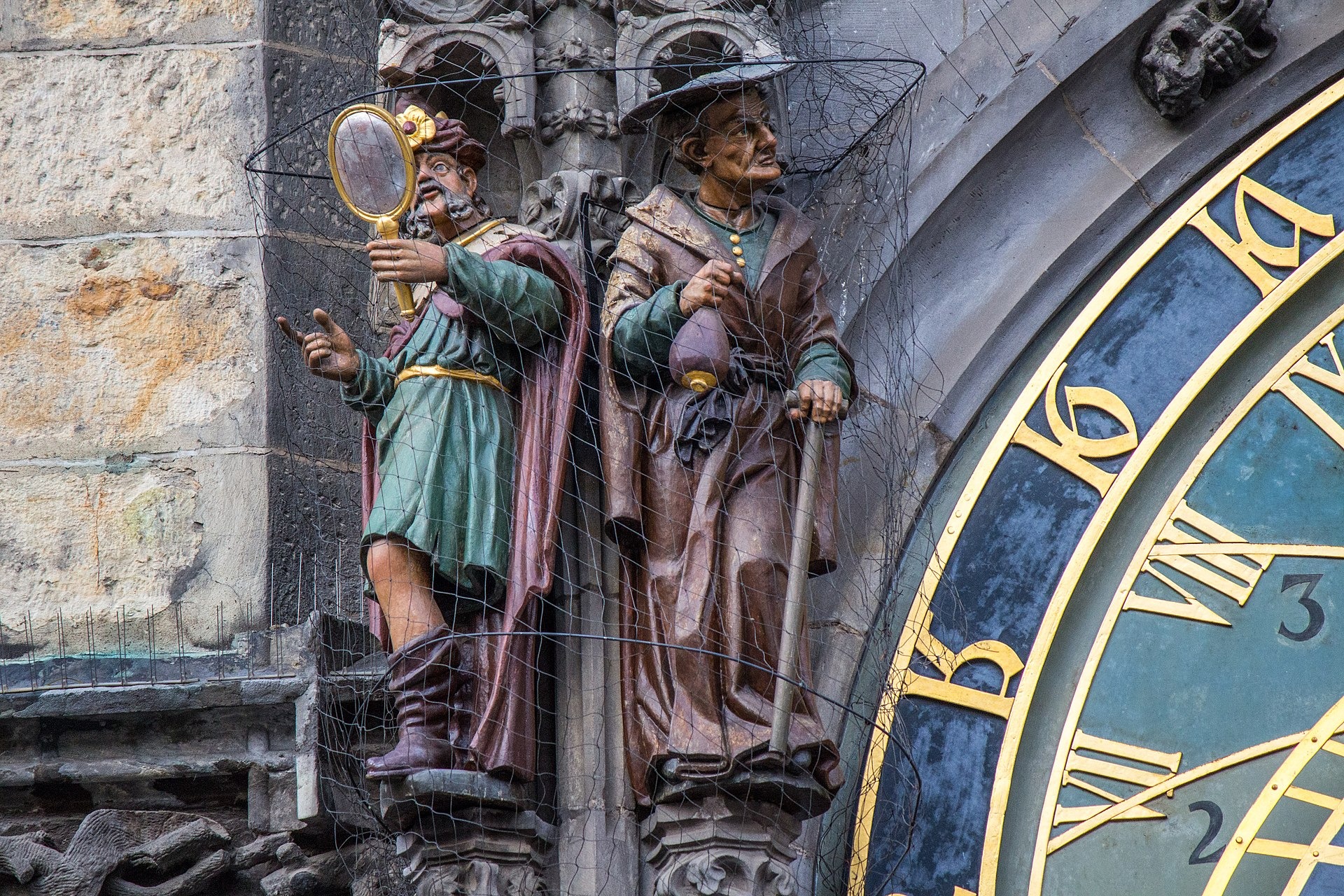 Statues representing Vanity and Avarice on the Prague astronomical clock