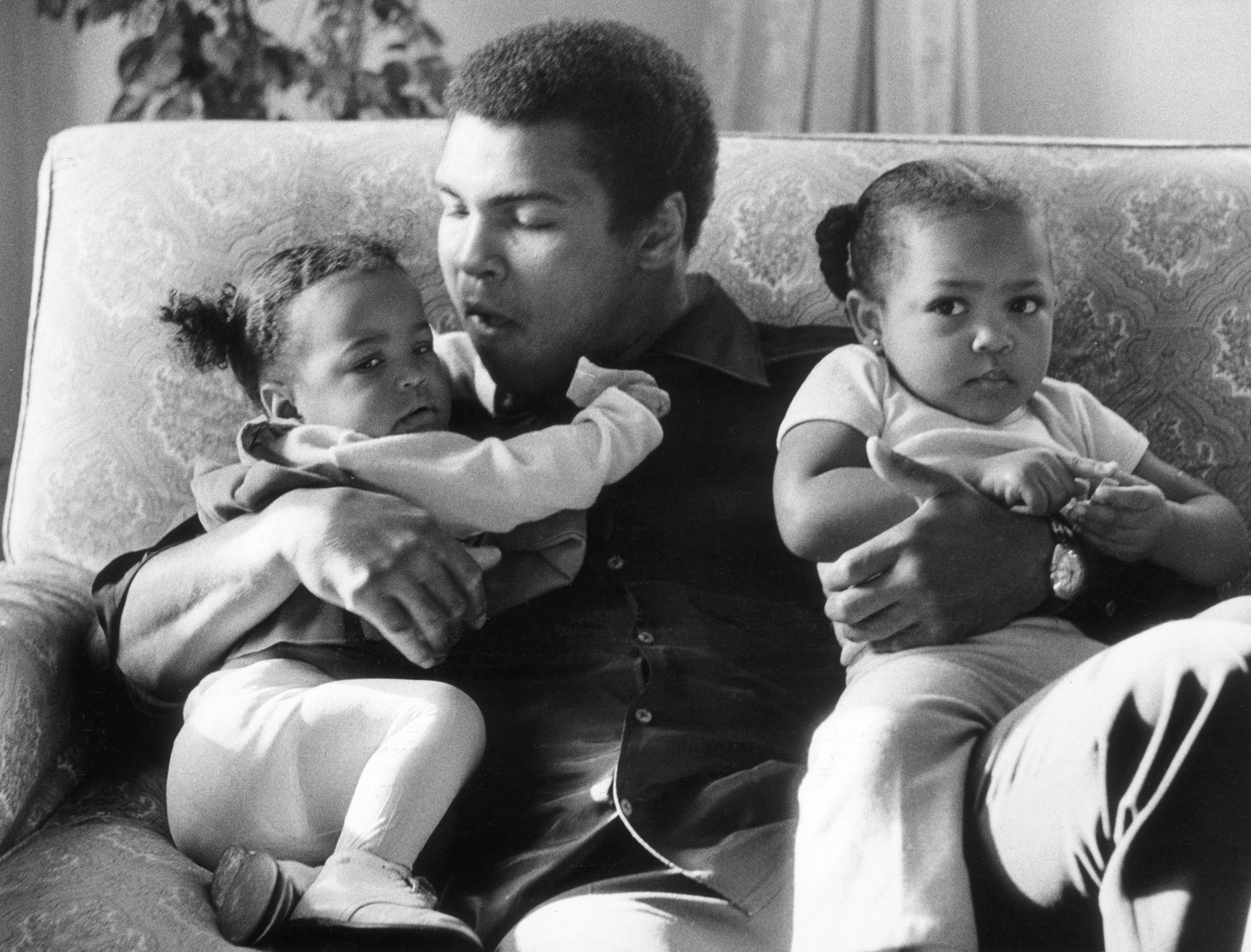  Out of the ring Ali was a family man, here he is pictured with his daughters Laila and Hanna