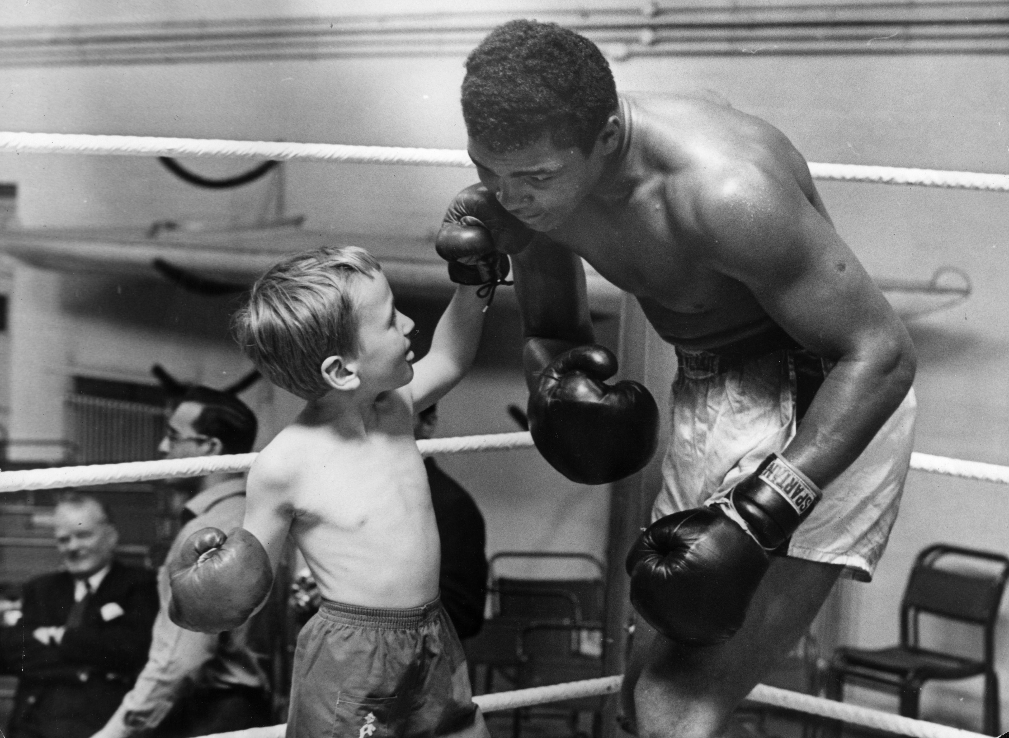  Ali gives six-year-old Patrick Power boxing lessons in order to combat bullies at home