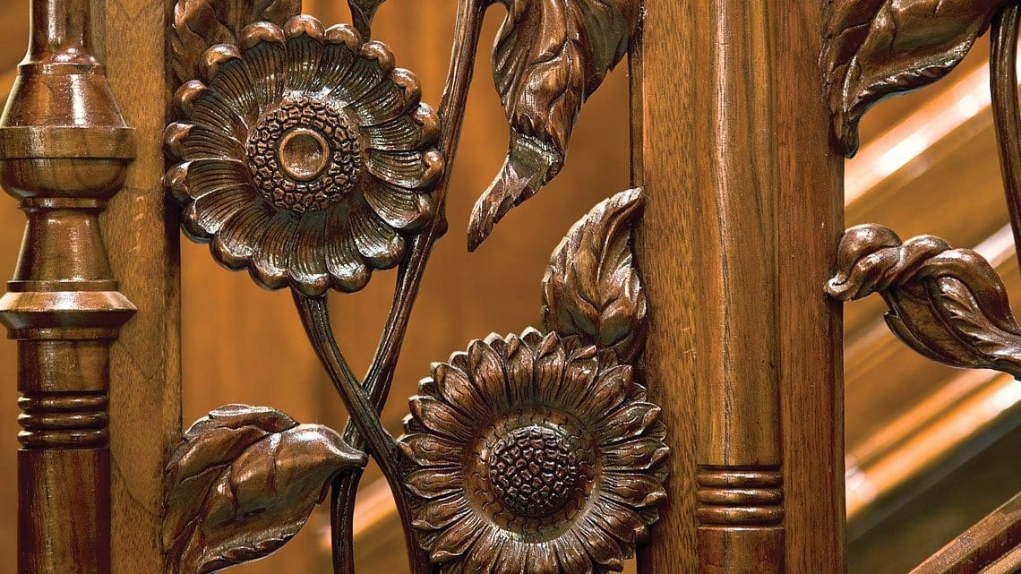 Sunflowers, a common motif of Aesthetic Movement style, adorn the banister of the stair hall.