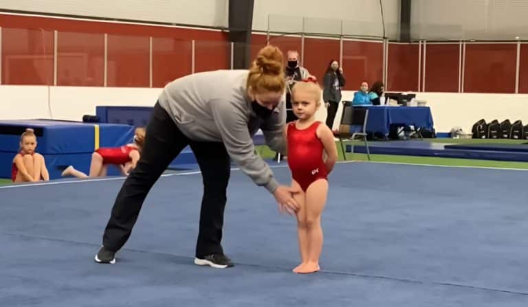 Coach Lends A Hand, Little Gymnast Shines On Stage