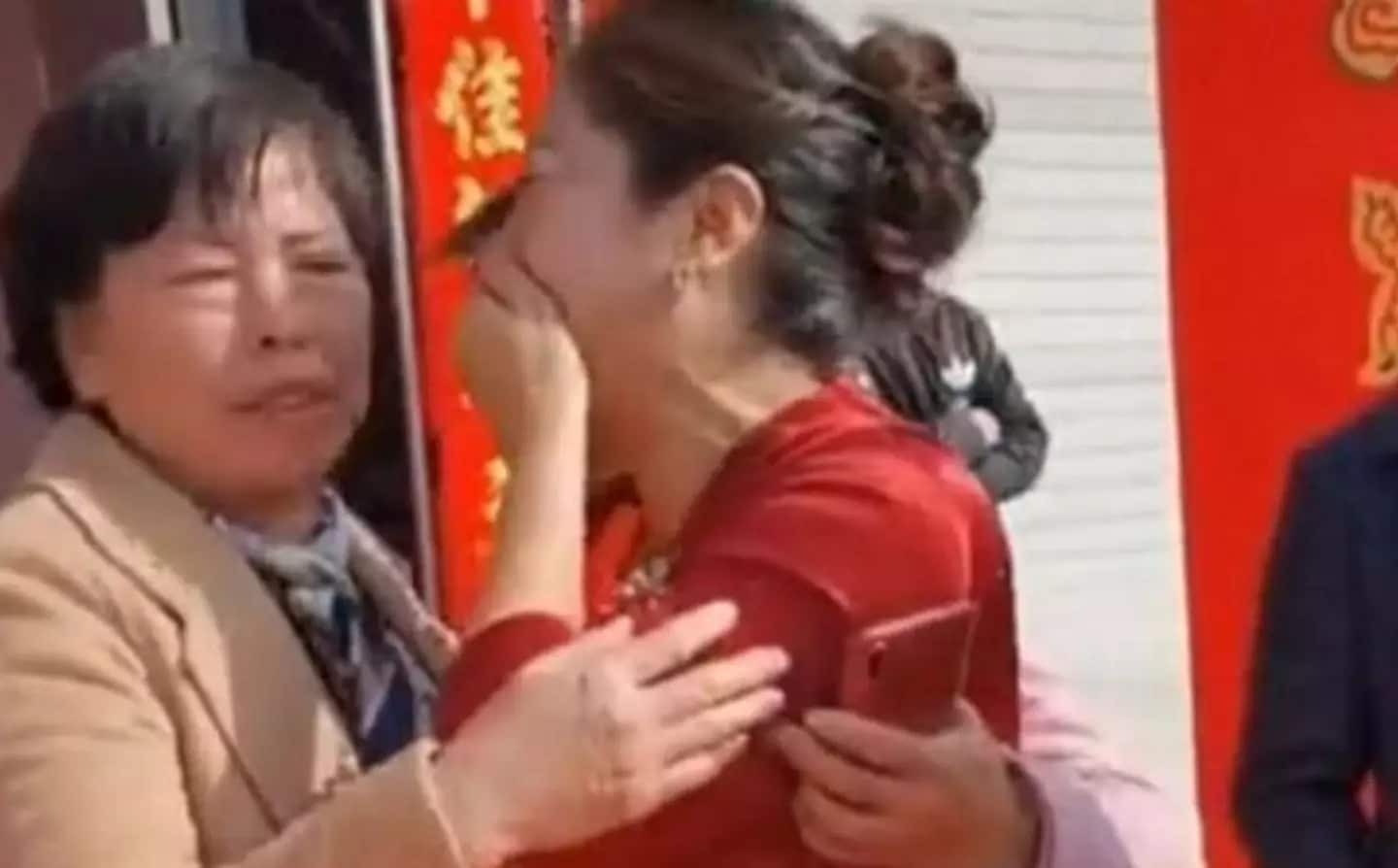 A Chinese mother reconnected with her long-lost daughter on her son's wedding day.