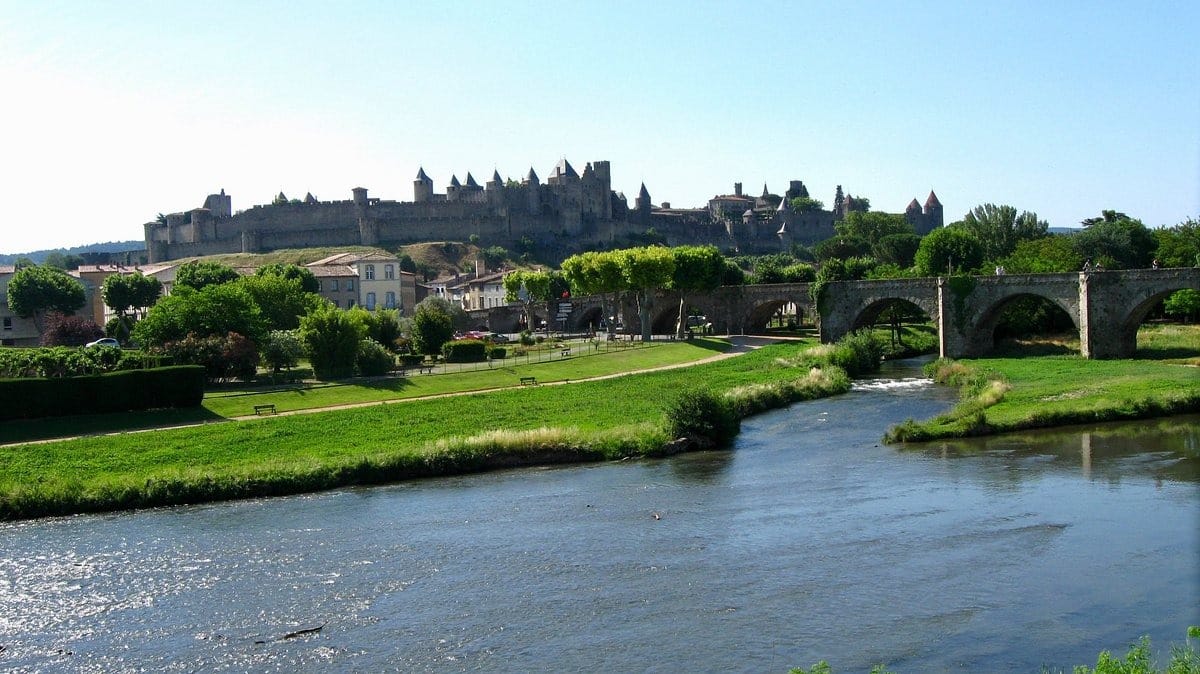 The fortified city of Carcassonne and the Pont Vieux crossing the Aude river