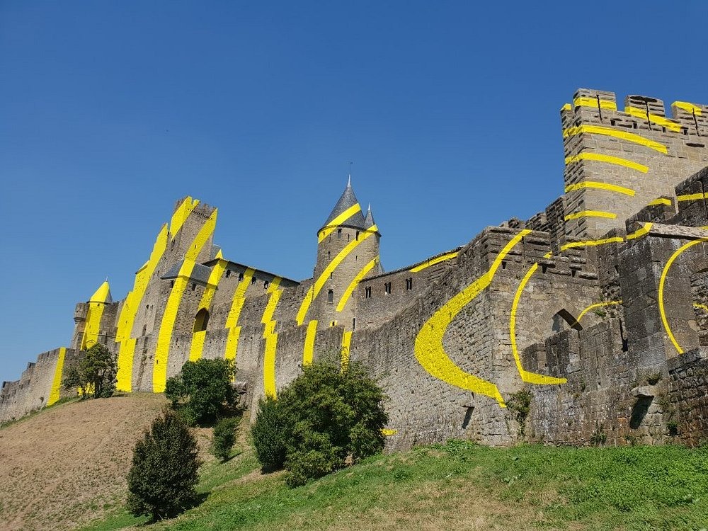 Felice Varini, project "Concentric, eccentric" with concentric yellow circles, at Carcassonne for the 7th "IN SITU, Heritage and contemporary art" event in May 2018 to celebrate the 20th anniversary of the inscription on the World Heritage List of UNESCO