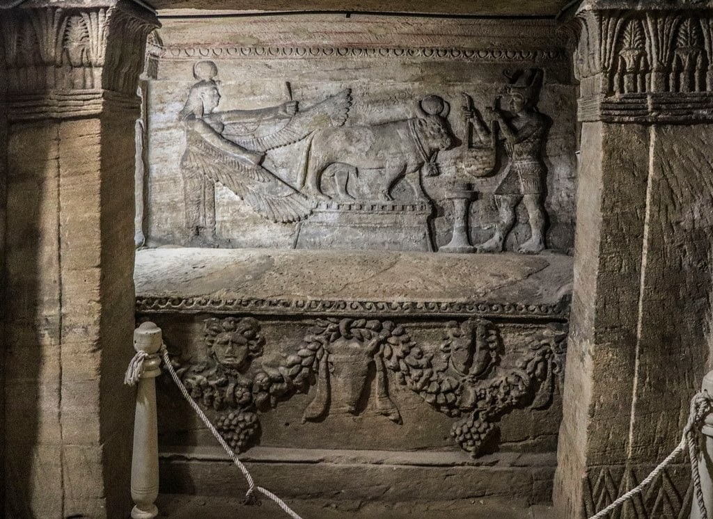 Decorated sarcophagus and panel with Apus-bull