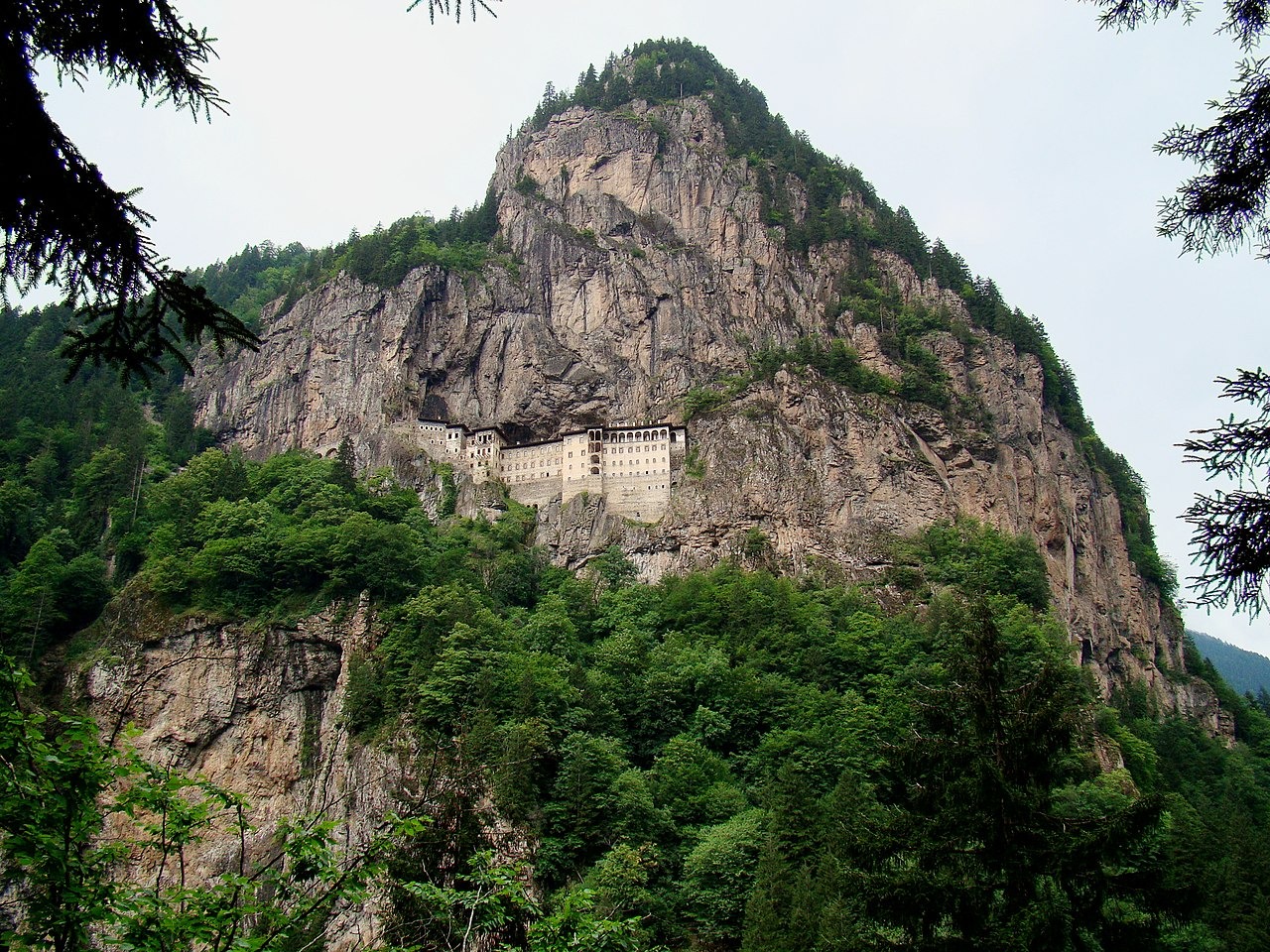 The monastery is on a ledge in a steep cliff