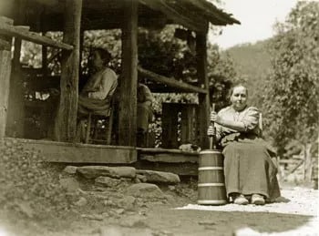 Martha and Hettie on the porch and Louisa at the churn.