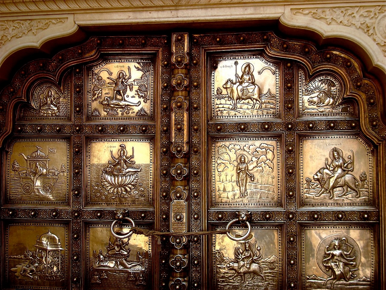 Embossed double leaf silver door entry into the Sila Devi temple