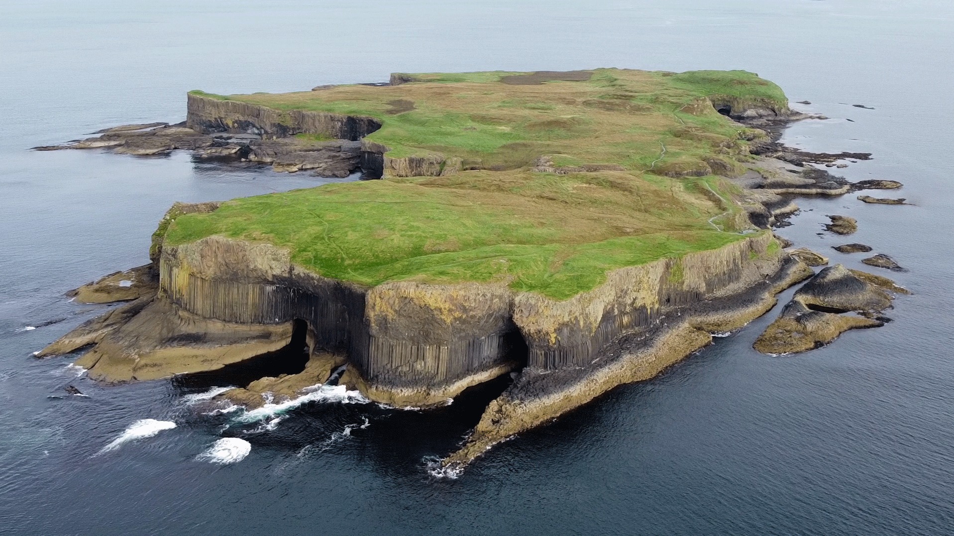 Aerial view of Staffa, with The Colonnade in the foreground and Am Buchaille to the right