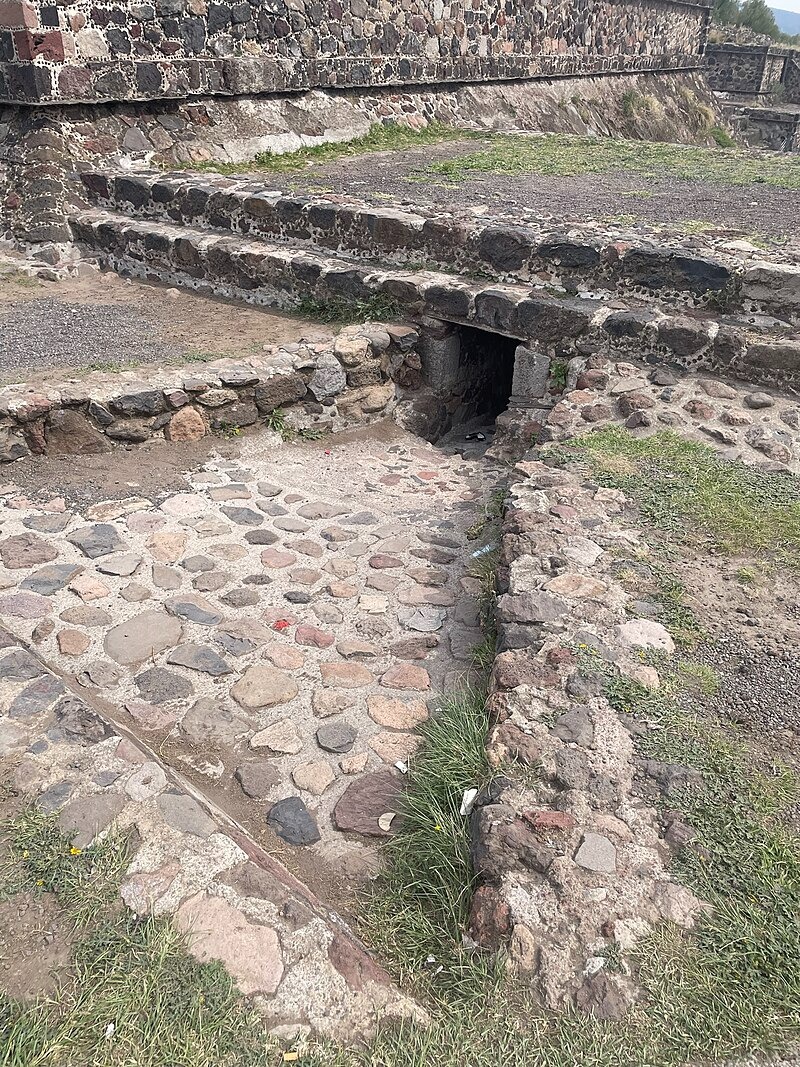 A tunnel under steps in the Great Compound along the Avenue of the Dead