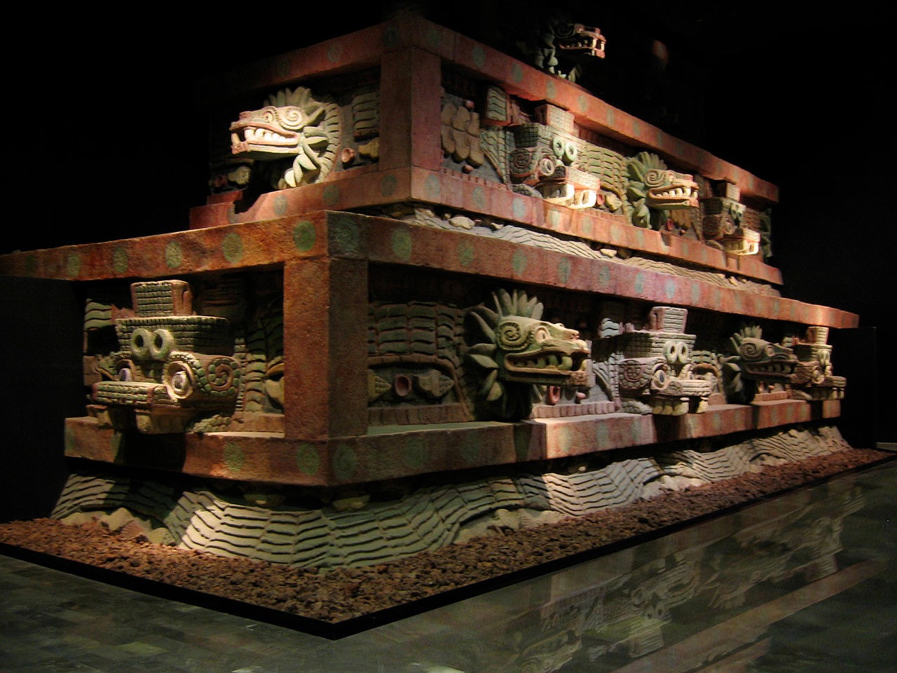 Restored portion of Teotihucan architecture showing the typical Mesoamerican use of red paint complemented on gold and jade decoration upon marble and granite