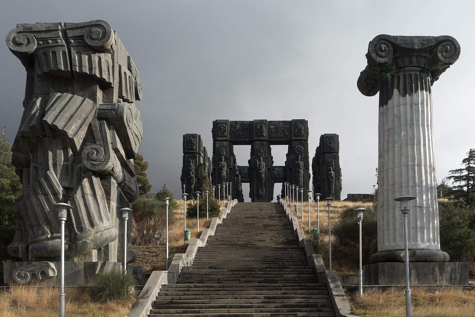 At the main entrance, where the stairs go up, stand the Ionic orders, which come into antonymous relation to each other, as the right column is whole and intact, while the left one is on the verge of collapse and is held by abstract power