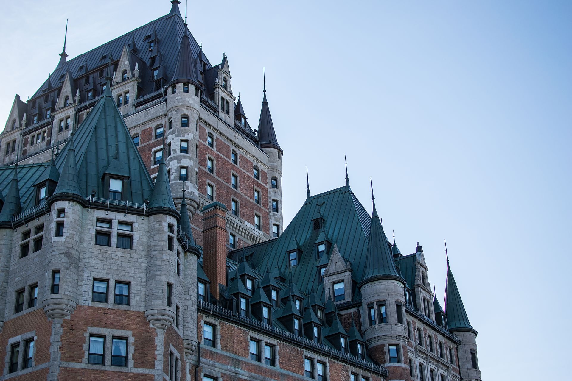 Designed in a Châteauesque style, the building features steep pitched roofs, circular and polygonal towers, and ornate gables and dormers.