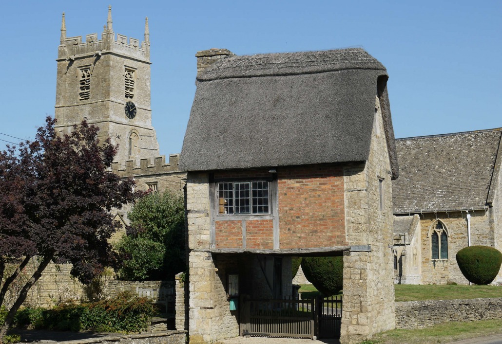 The thatched lych gate and parish church