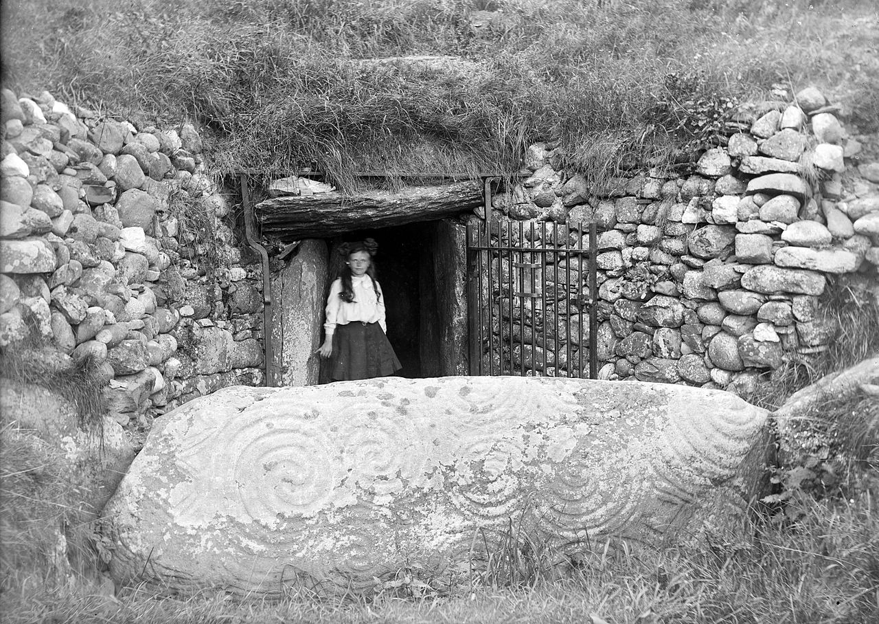 The entrance to Newgrange in the early 1900s, after much of the debris had been cleared and a drystone wall built