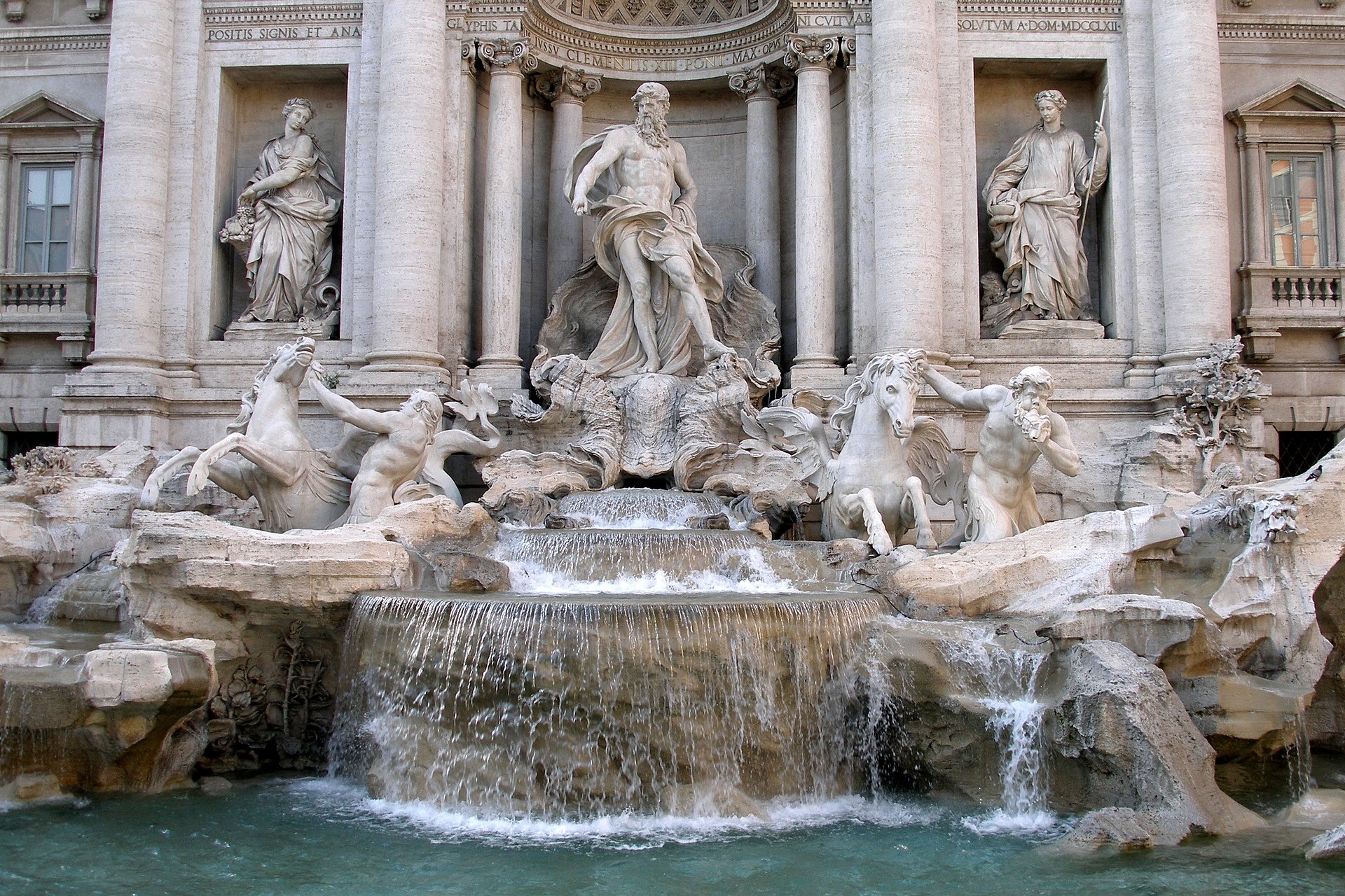 The god Oceanus springs from the central niche on a shell chariot pulled by two hippocamps and two cascading tritons